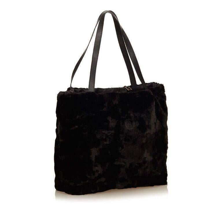 Product details:  Black fur tote bag by Fendi.  Dual leather shoulder straps.  Open top.  Lined interior.  21.75