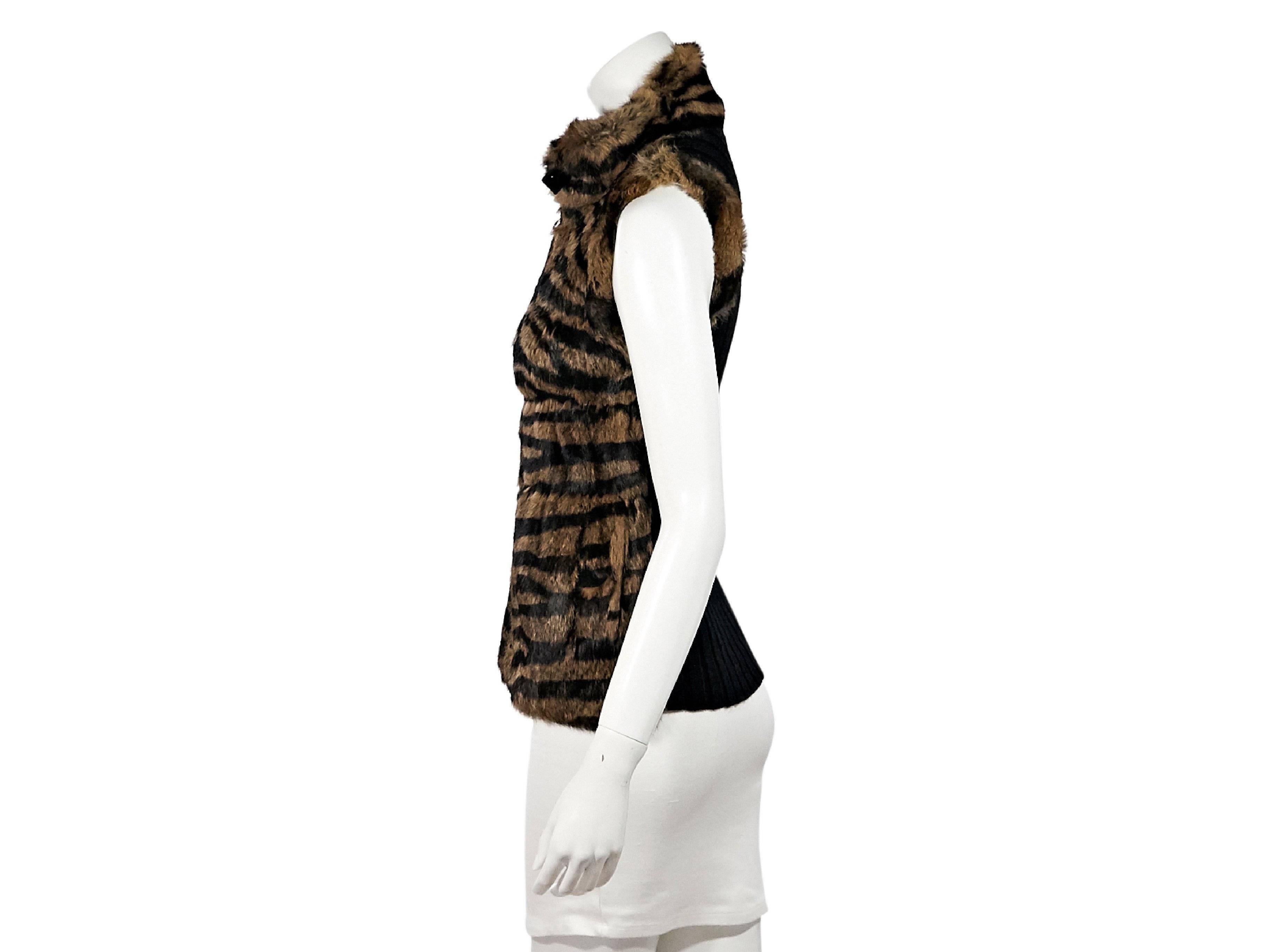 Product details:  Brown and black printed rabbit fur-front vest by Jocelyn.  Stand collar.  Zip-front closure.  Ribbed knit back.  
Condition: Pre-owned. Very good.
Est. Retail $ 625.00