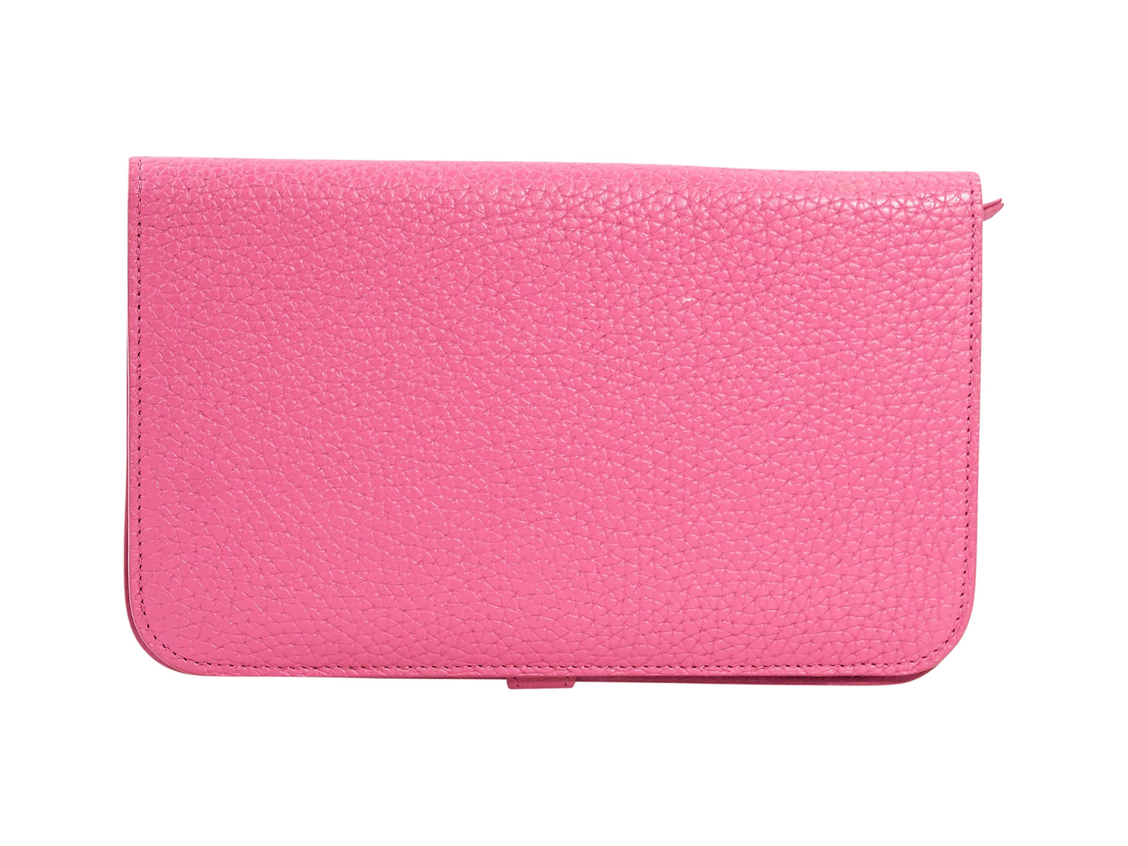 Product details:  Pink pebbled leather Togo Dogon combined wallet by Hermès.  Tab closure.  Silvertone hardware.  Leather interior with inner credit card slots, bill compartment and zip pouch.  Original box included.  5
