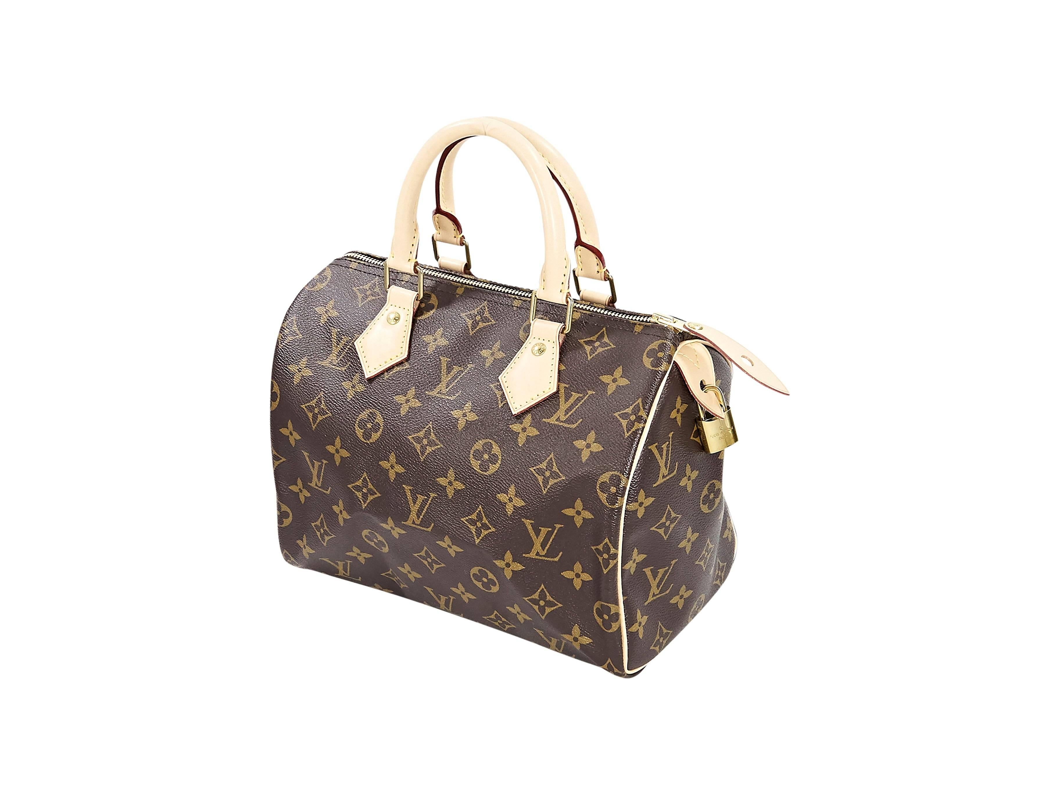 Product details:  Brown monogram Speedy 25 handbag by Louis Vuitton.  Top leather carry handles.  Top zip closure.  Lined interior with inner zip pocket.  Goldtone hardware.  10