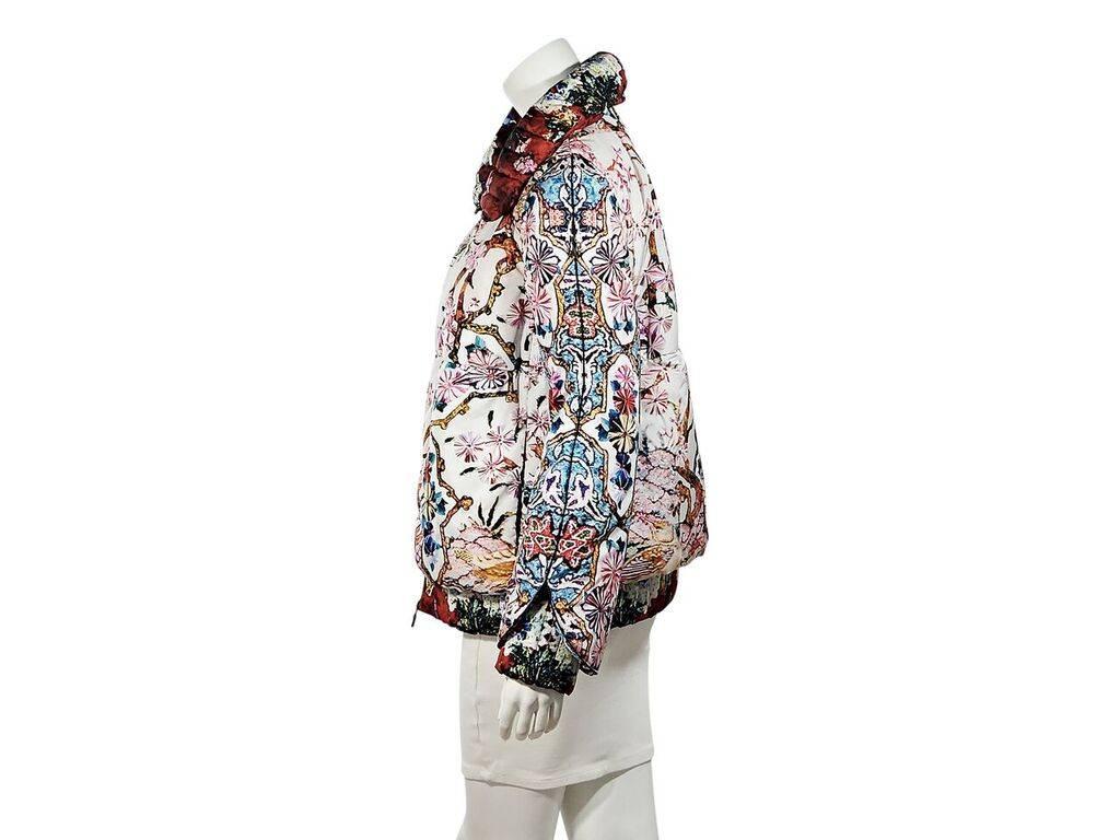 Product details:  Multicolor graphic printed puffer coat by Moncler.  Spread collar.  Long sleeves.  Elasticized cuffs and hem.  Zip-front closure.  Label size 3.
Condition: Pre-owned. Very good.
Est. Retail $ 1,300.00