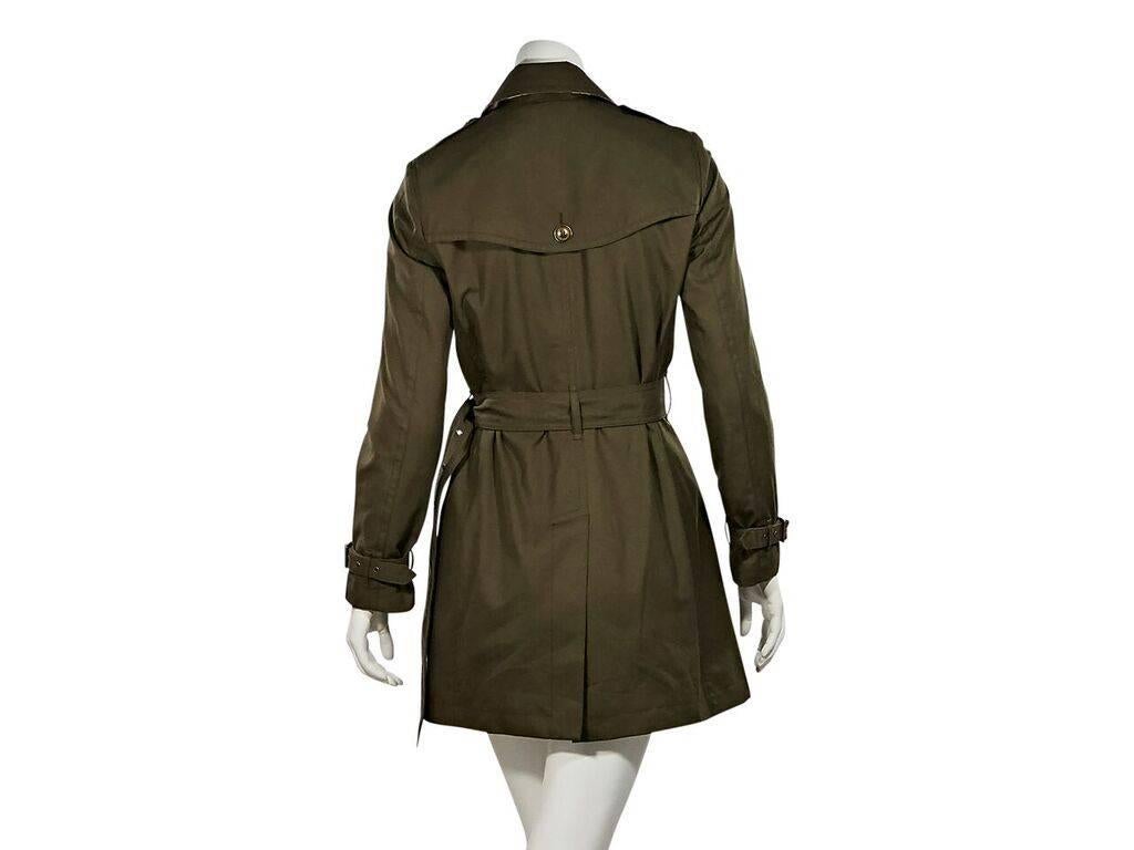 Product details:  Olive green trench coat by Burberry Brit.  Spread collar.  Long sleeves.  Adjustable belted cuffs.  Shoulder button epaulettes.  Double-breasted button-front closure.  Adjustable belted waist.  Waist slide pockets.  Front and back