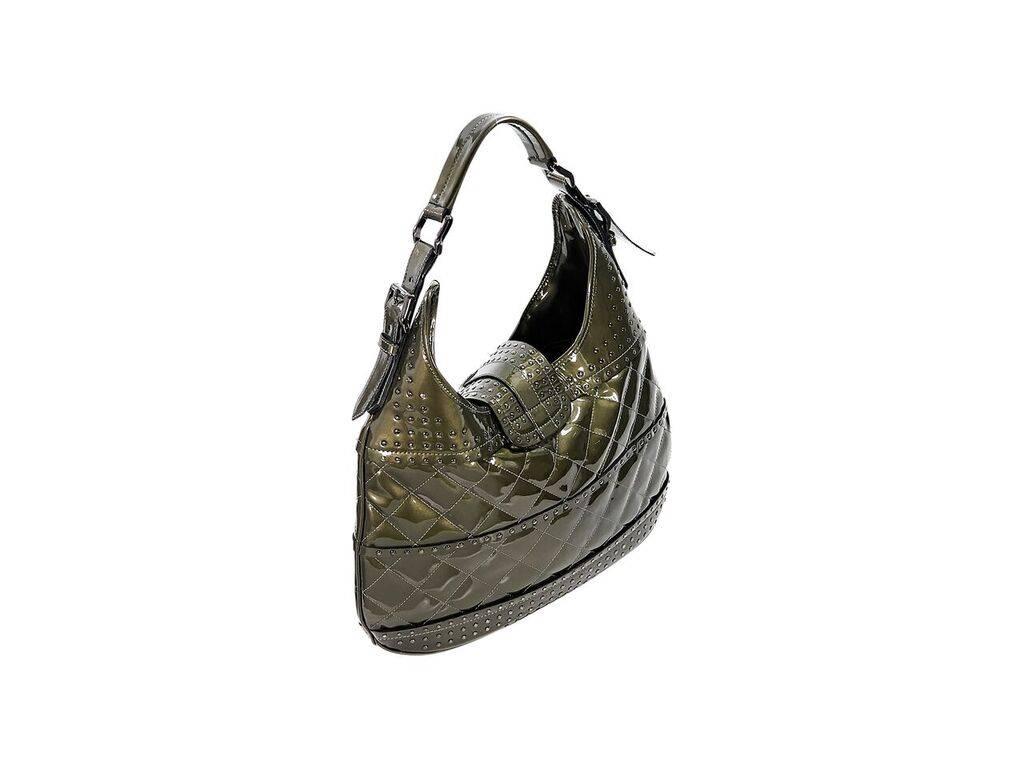 Product details:  Olive green quilted patent leather hobo bag by Burberry.  Accented with studs.  Adjustable single shoulder strap.  Top strap closure.  Lined interior with inner zip and slide pockets.  Gunmetal-tone hardware.  15