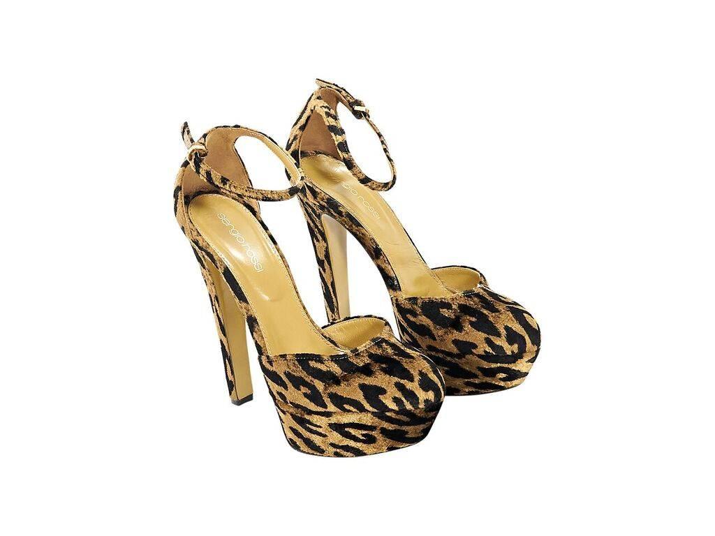 Product details:  Tan and black leopard-print velvet pumps by Sergio Rossi.  Adjustable ankle strap.  Round toe.  Towering heel and platform design. 
Condition: Pre-owned. Very good.
Est. Retail $ 728.00