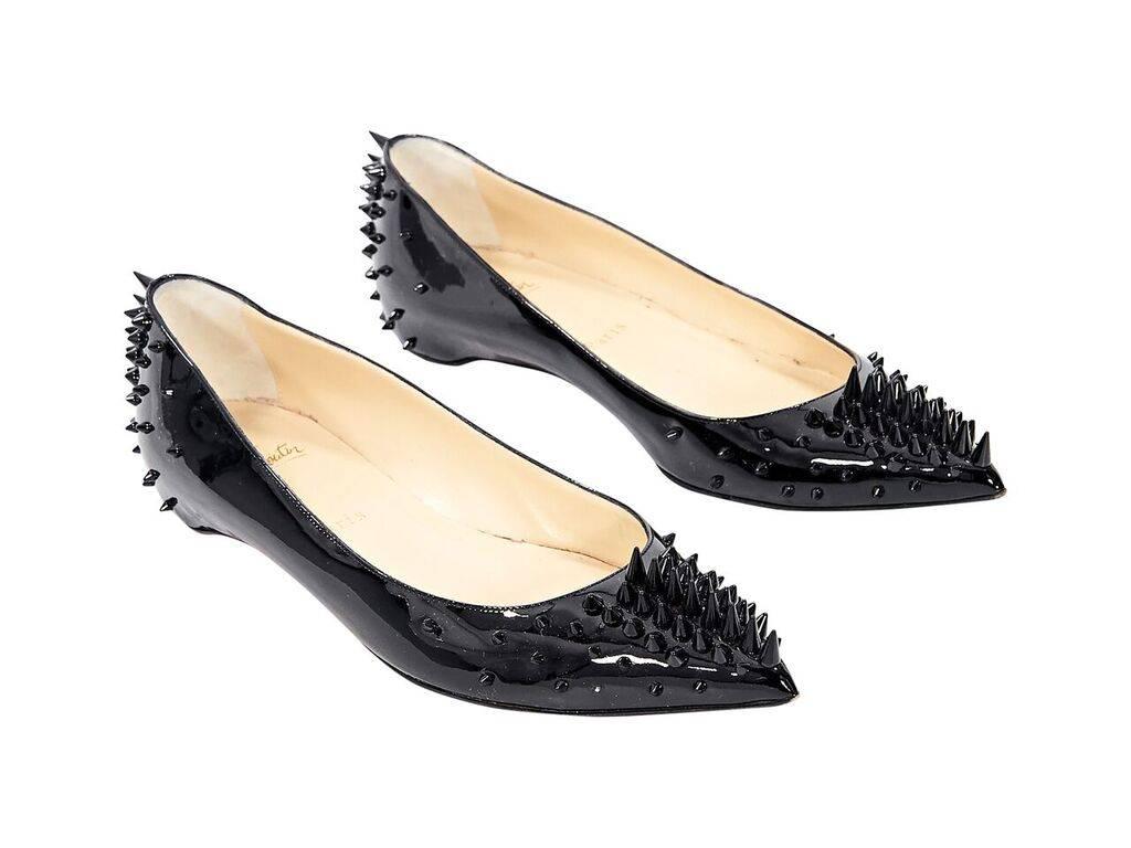 Product details: Black patent leather spiked Pigalle flats by Christian Louboutin.  Point toe.  Red iconic sole.  Slip-on style. 
Condition: Pre-owned. Very good.
Est. Retail $ 1,095.00