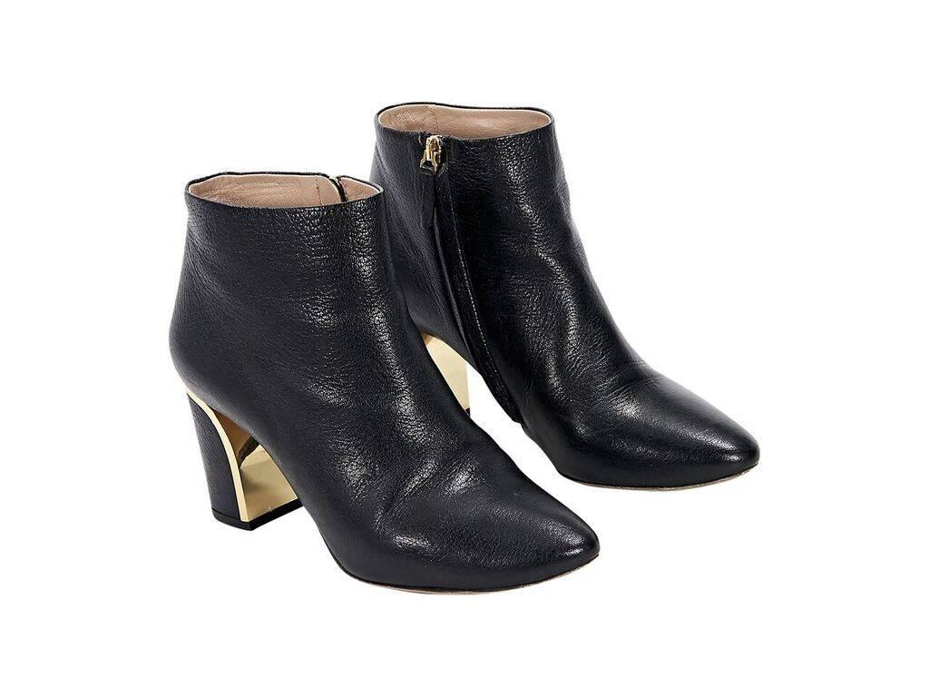 Product details: Black leather ankle boots by Chloe.  Inner zip closure.  Metallic goldtone hardware trim.  Round toe. 
Condition: Pre-owned. Very good.
Est. Retail $ 898.00