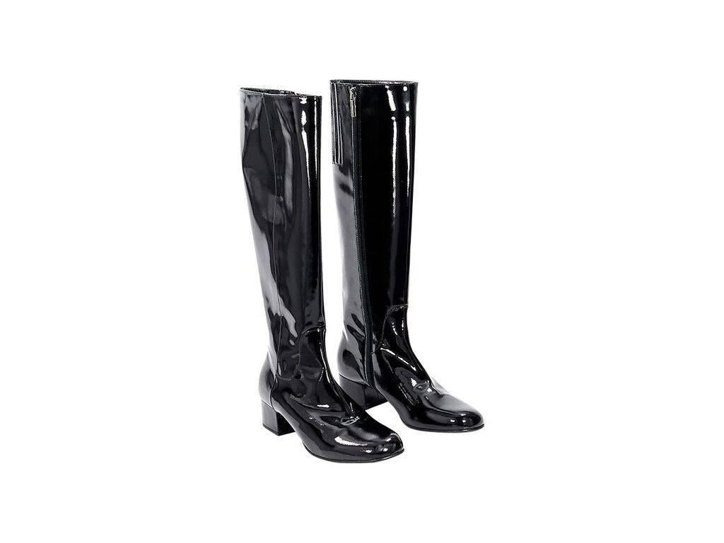 Product details:  Black patent leather knee-high boots by Aquatalia.  Inner zip closure.  Round toe.  
Condition: Pre-owned. Very good.
Est. Retail $ 748.00