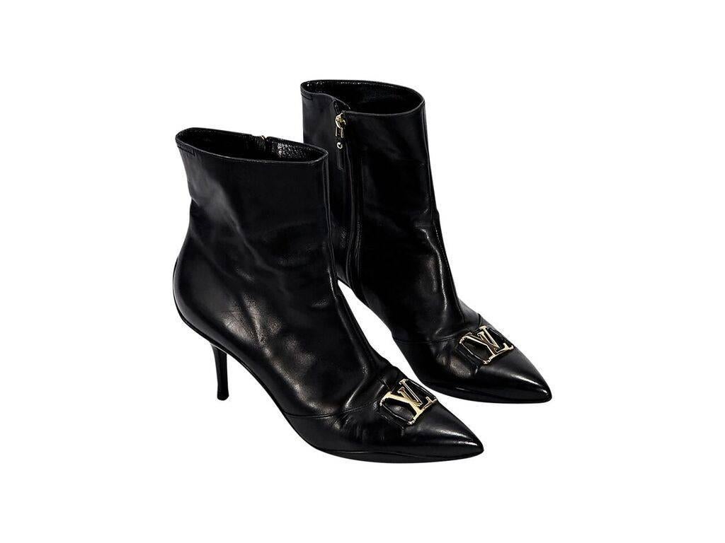 Product details:  Black leather ankle boots by Louis Vuitton.  Inner zip closure.  Logo hardware accents vamp.  Point toe.  Goldtone hardware. 
Condition: Pre-owned. Very good.
Est. Retail $ 995.00