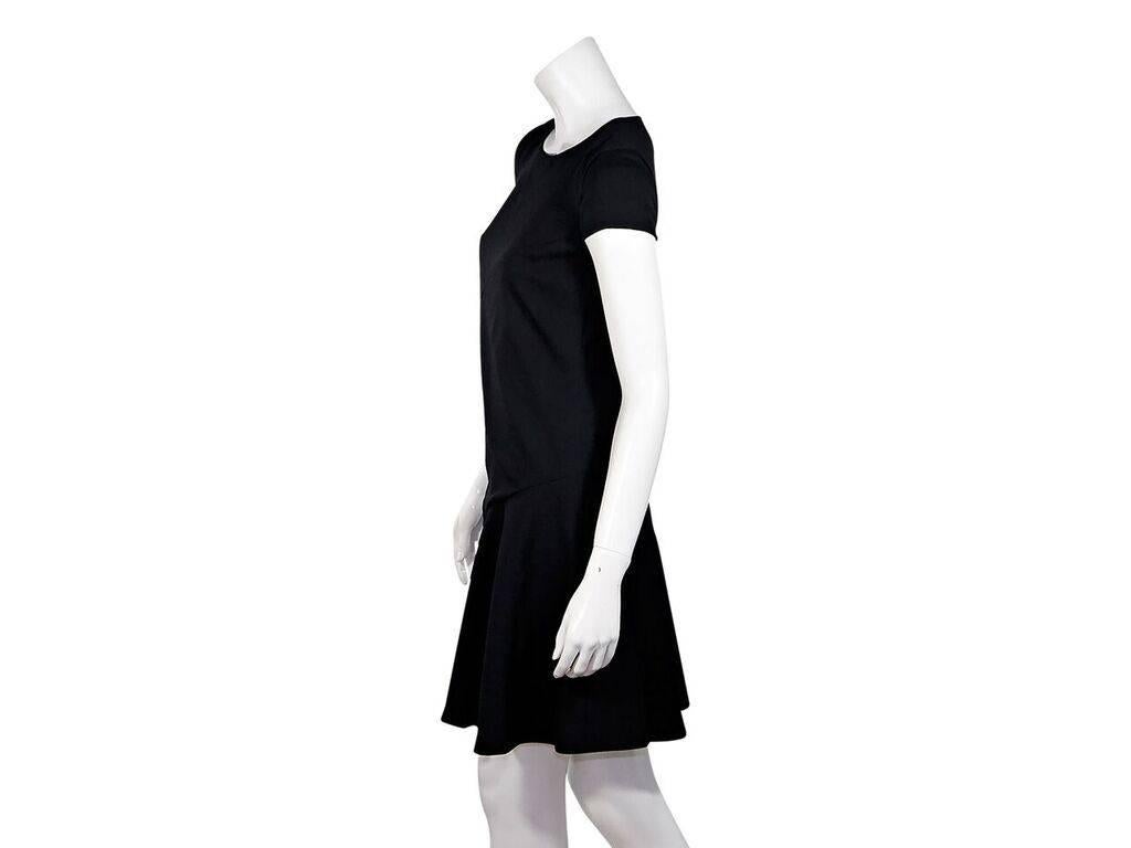 Product details:  Black bias cut A-line dress by Emilio Pucci.  Round neck.  Short sleeves.  Exposed back zip closure.  Label size IT 38.
Condition: Pre-owned. New with tags.
Est. Retail $ 995.00