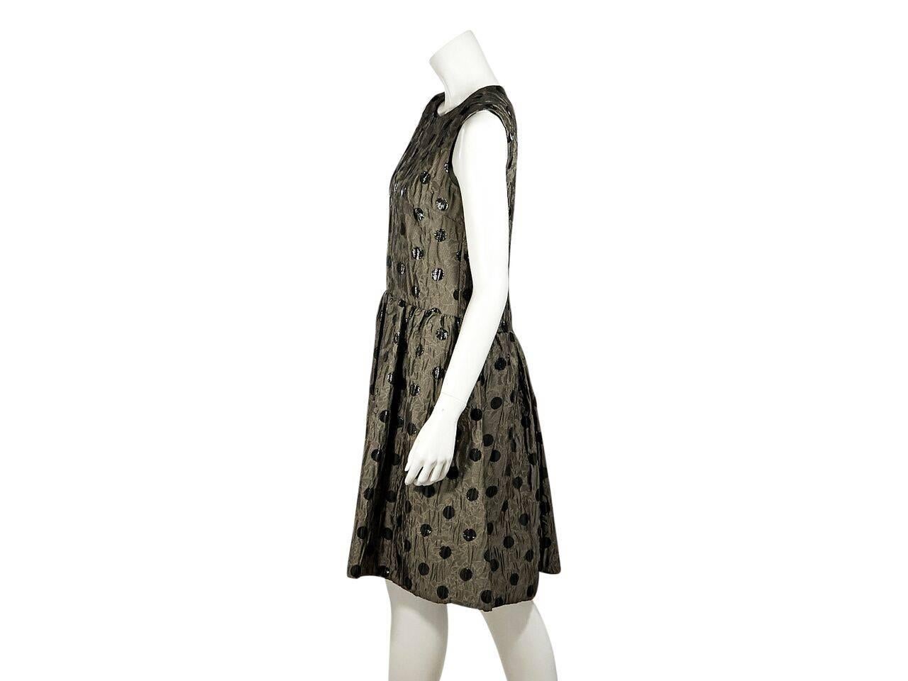 Product details:  Bronze polka-dot jacquard dress by Marc By Marc Jacobs.  Round neck.  Sleeveless.  Exposed back zip closure.  A-line skirting.  
Condition: Pre-owned. New with tags.
Est. Retail $ 698.00