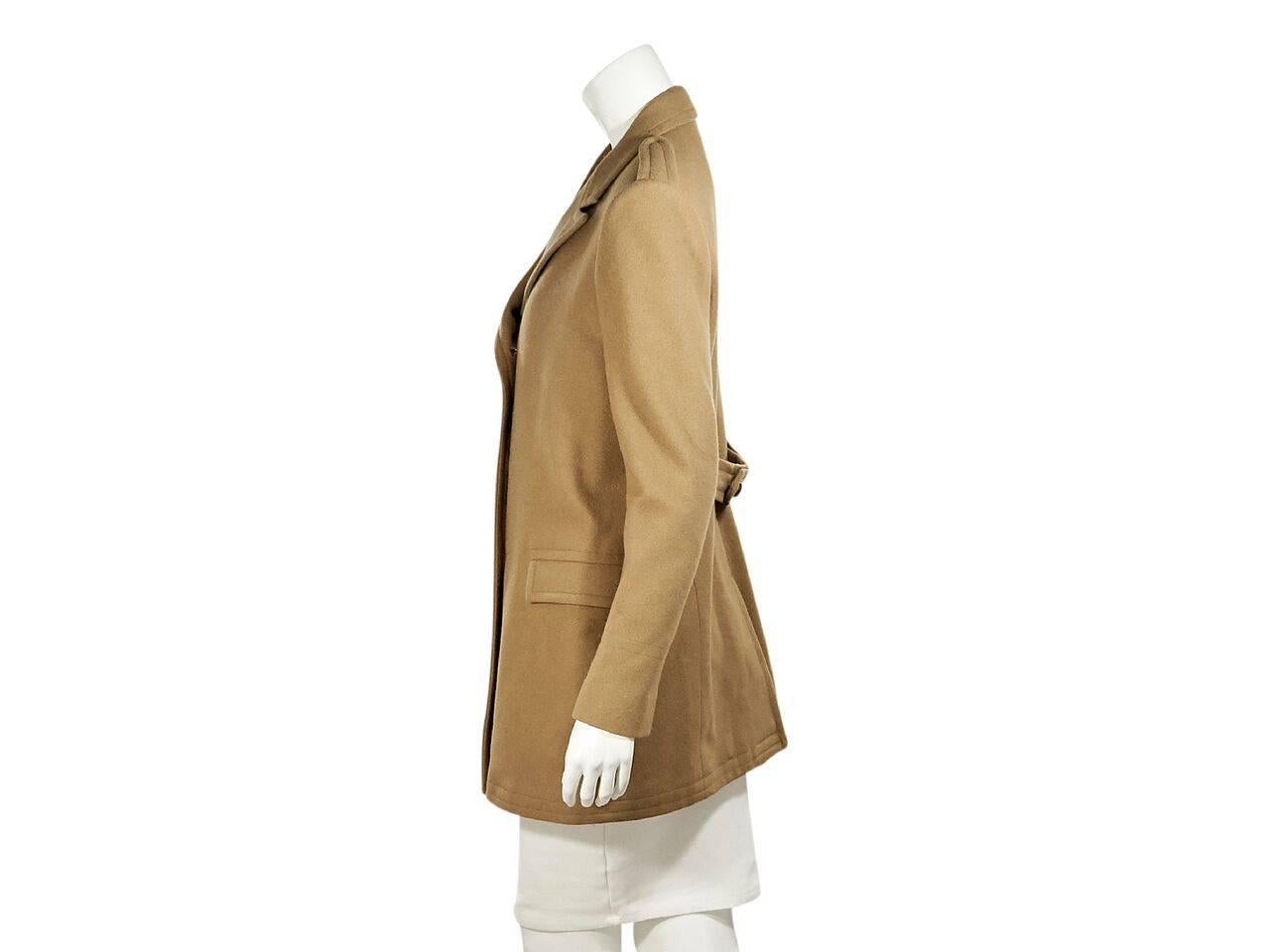 Product details:  Camel double-breasted coat by Boy. By Band Of Outsiders.  Peak lapel.  Long sleeves.  Double-breasted button-front closure.  Waist flap pockets.  Back hem vent.  Label size 4. 
Condition: Pre-owned. Very good.
Est. Retail $ 1,095.00