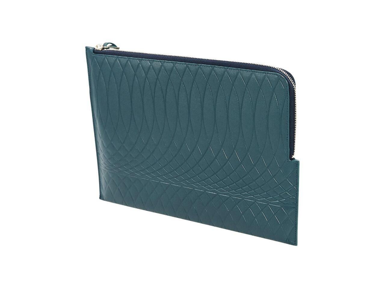 Product details:  Teal leather embossed pouch by Paul Smith.  Top zip closure.  Lined interior.  Silvertone hardware.  11