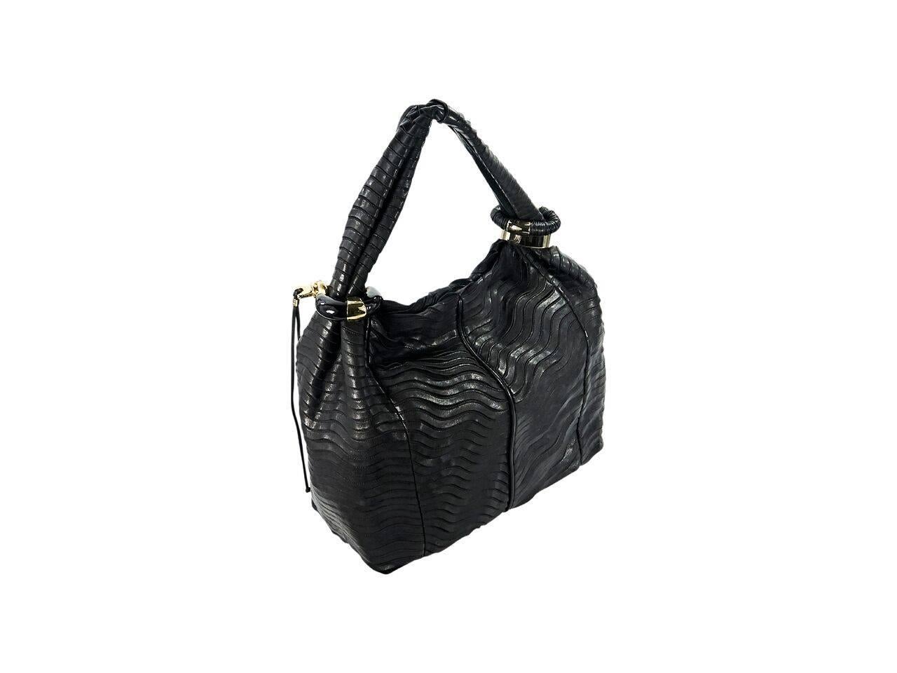 Product details:  Black leather Saba hobo bag by Jimmy Choo.  Single shoulder strap.  Magnetic snap closure.  Lined interior with inner zip and slide pockets.  Goldtone hardware.  16