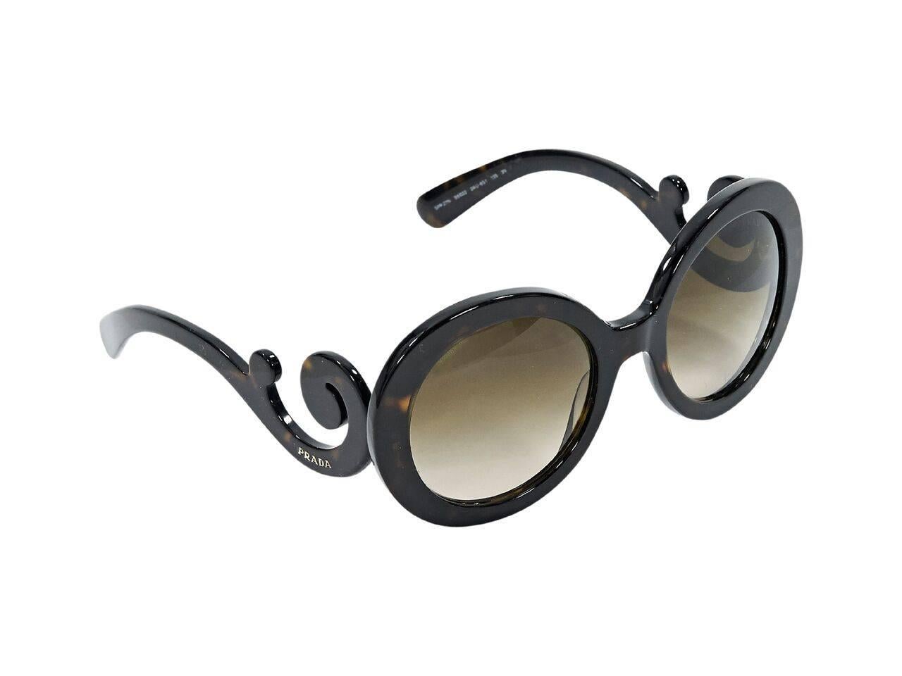 Product details:  Brown oversized round Baroque sunglasses by Prada.  Gradient lenses. 
Condition: Pre-owned. Very good.
Est. Retail $ 598.00