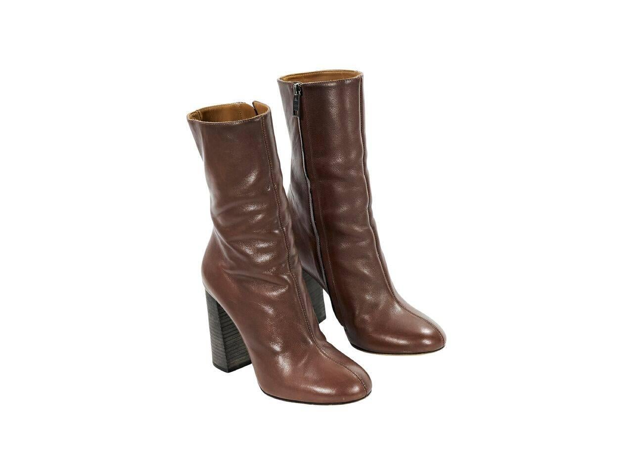 Product details:  Brown leather mid-calf boots by Chloe.  Inner zip closure.  Chunky stacked heel.  Round toe.  
Condition: Pre-owned. Very good.
Est. Retail $ 898.00