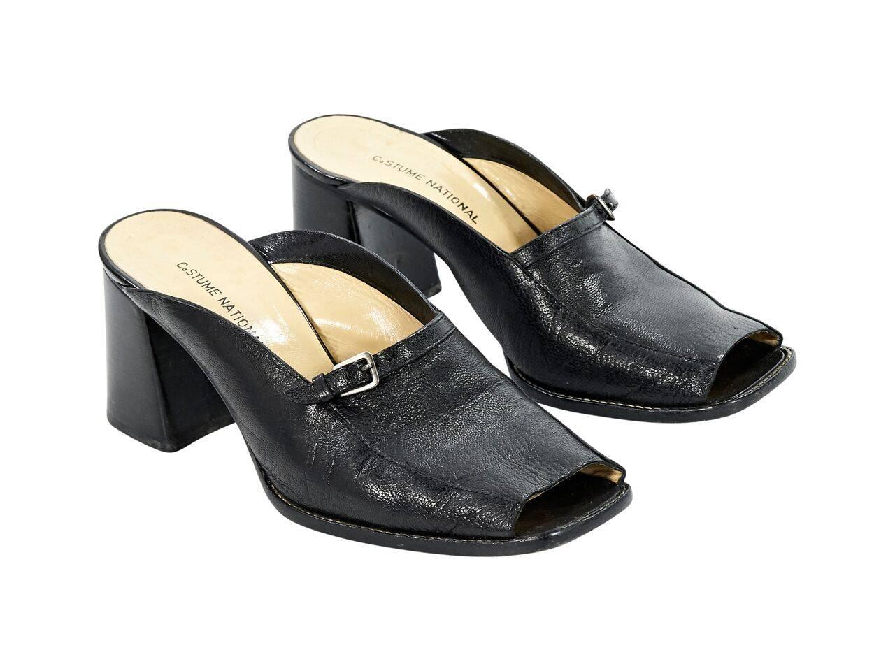 Product details:  Black leather loafer mules by Costume National.  Peep toe.  Chunky stacked heel.  Slip-on style. 
Condition: Pre-owned. Very good.
Est. Retail $ 498.00