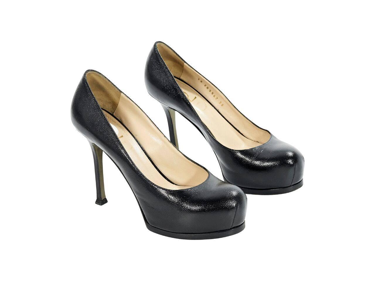 Product details:  Black pebbled leather platform pumps by Yves Saint Laurent.  Round toe.  Covered platform.  Slip-on style. 
Condition: Pre-owned. Very good.
Est. Retail $ 698.00