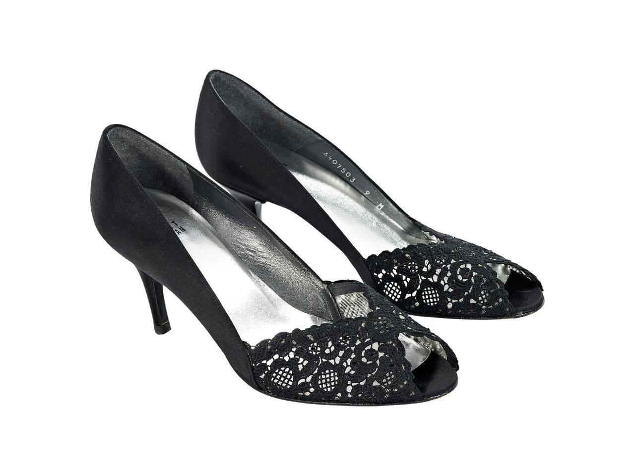 Product details:  Black satin and lace pumps by Stuart Weitzman.  Peep toe.  Slip-on style. 
Condition: Pre-owned. Very good.
Est. Retail $ 448.00