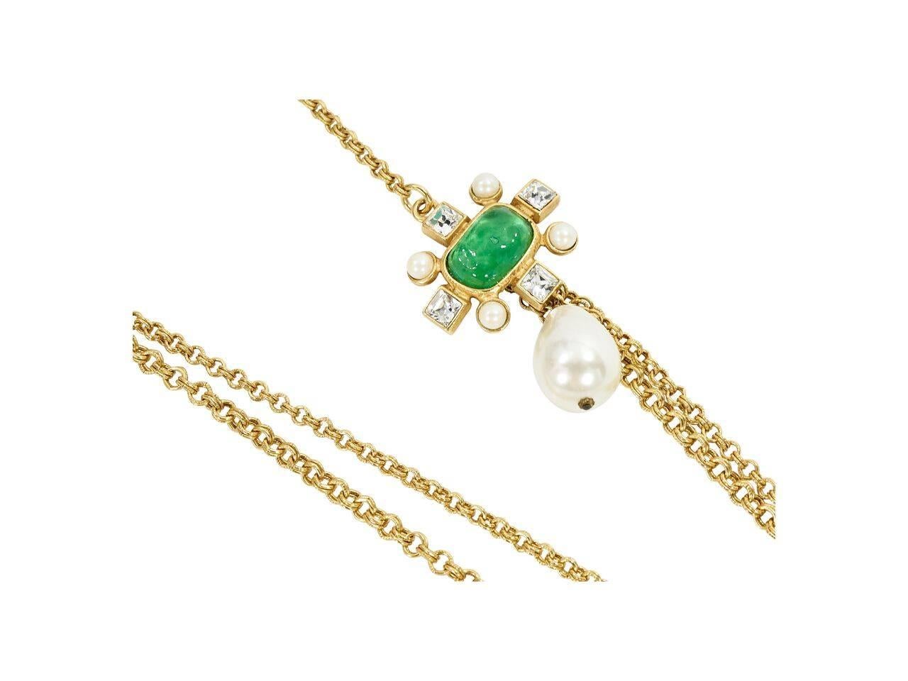 Product details:  Vintage double strand chain necklace by Gerard Yosca.  Accented with a green stone and faux pearl pendant.  Lobster clasp closure.  16.5