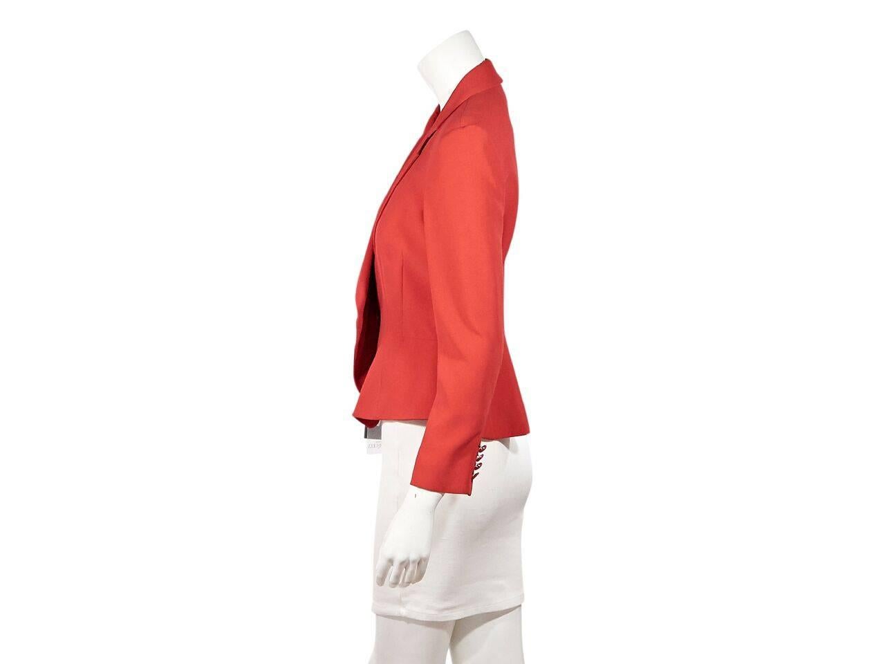 Product details:  Red peplum waist blazer by Alexander McQueen  Notched lapel.  Bracelet-length sleeves.  Four-button detail at cuffs.  Concealed button-front closure.  Label size IT 44. 
Condition: Pre-owned. New with tags.
Est. Retail $ 1,975.00