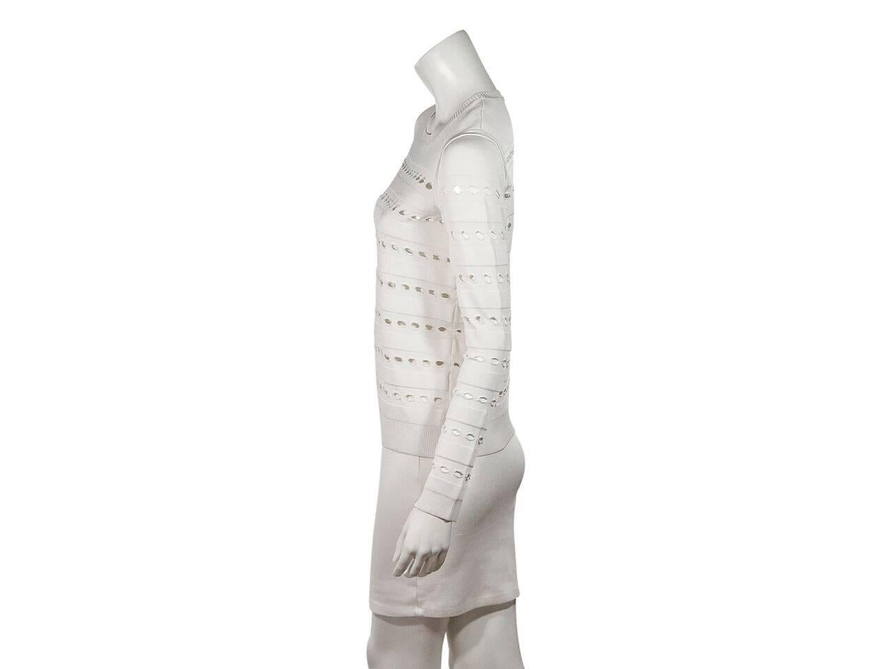 Product details:  White cutout striped sweater by Herve Leger.  Roundneck.  Long sleeves.  Ribbed cuffs and hem.  Pullover style. 
Condition: Pre-owned. Very good.
Est. Retail $ 995.00