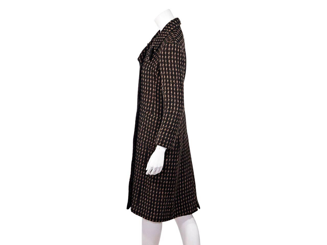 Product details:  Brown check wool coat by Miu Miu.  Oversized notched lapel.  Long sleeves.  Double-breasted button-front closure.  Waist patch pockets.  Back hem vent.  Label size IT 44. 
Condition: Pre-owned. Very good.
Est. Retail $ 798.00