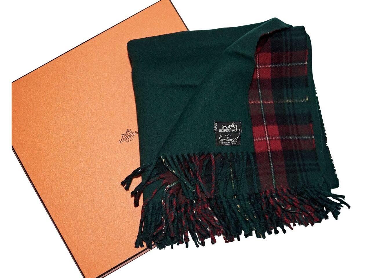 Product details:  Vintage green and red plaid lambswool scarf by Hermes.  Fringe trim.  Original box included. 
Condition: Pre-owned. Very good.
Est. Retail $ 1,500.00
