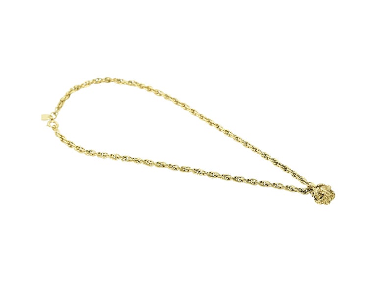 Product details:  Vintage goldtone single strand chain necklace by Chanel.  Knotted ball pendant.  Spring ring closure.  14.75