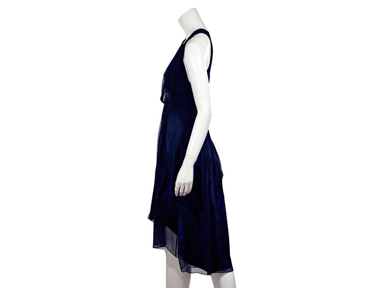 Product details:  Dark blue printed silk dress by Haute Hippie.  Plunging v-neck.  Sleeveless.  Asymmetrical crisscross back straps.  Concealed back zip closure.  Hi-lo hem.
Condition: Pre-owned. New with tags.
Est. Retail $ 795.00