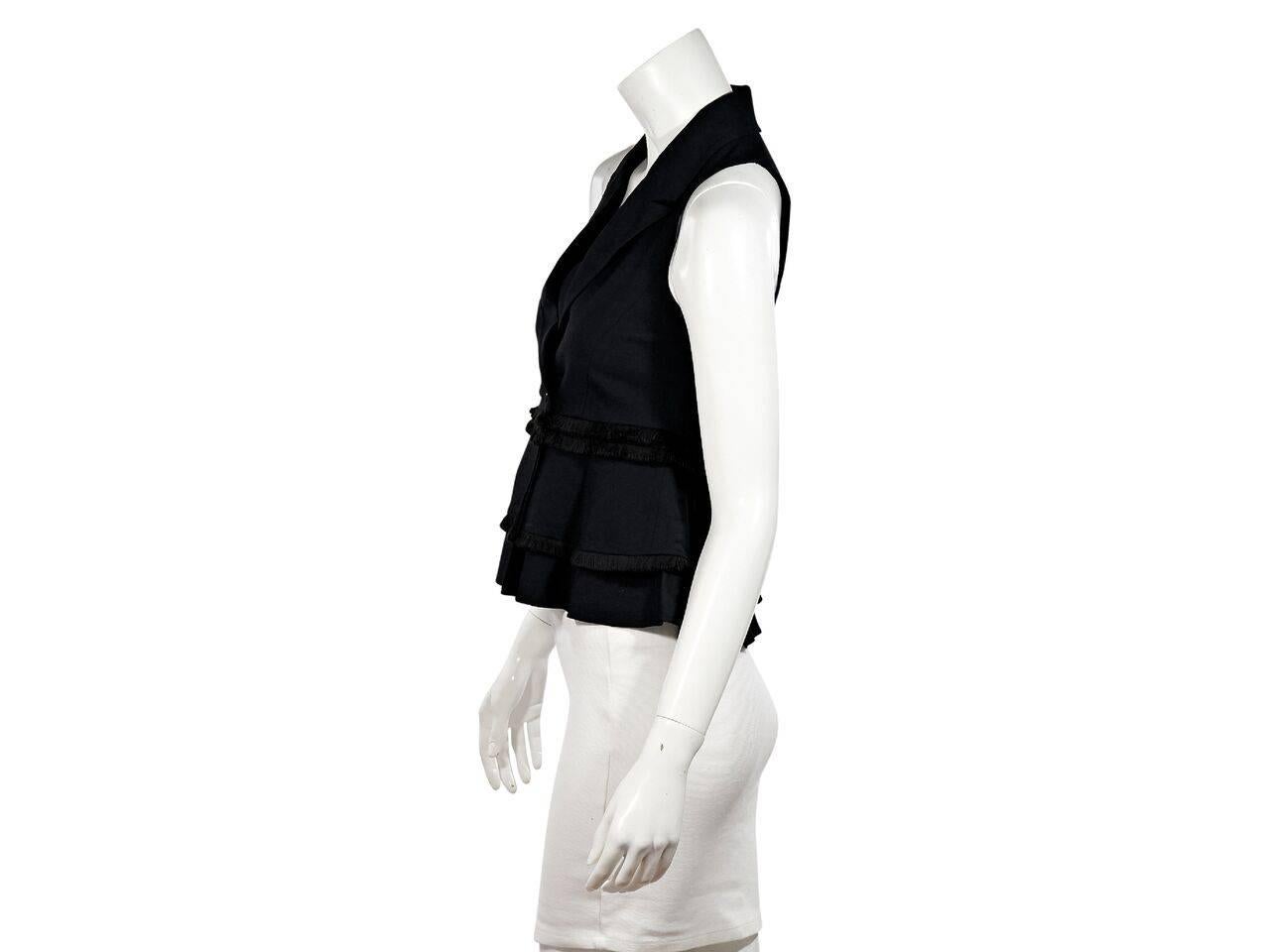 Product details:  Black fringe-trim crepe vest top by Marissa Webb.  V-neck.  Sleeveless.  Double-breasted button-front closure.  
Condition: Pre-owned. New with tags.
Est. Retail $ 428.00