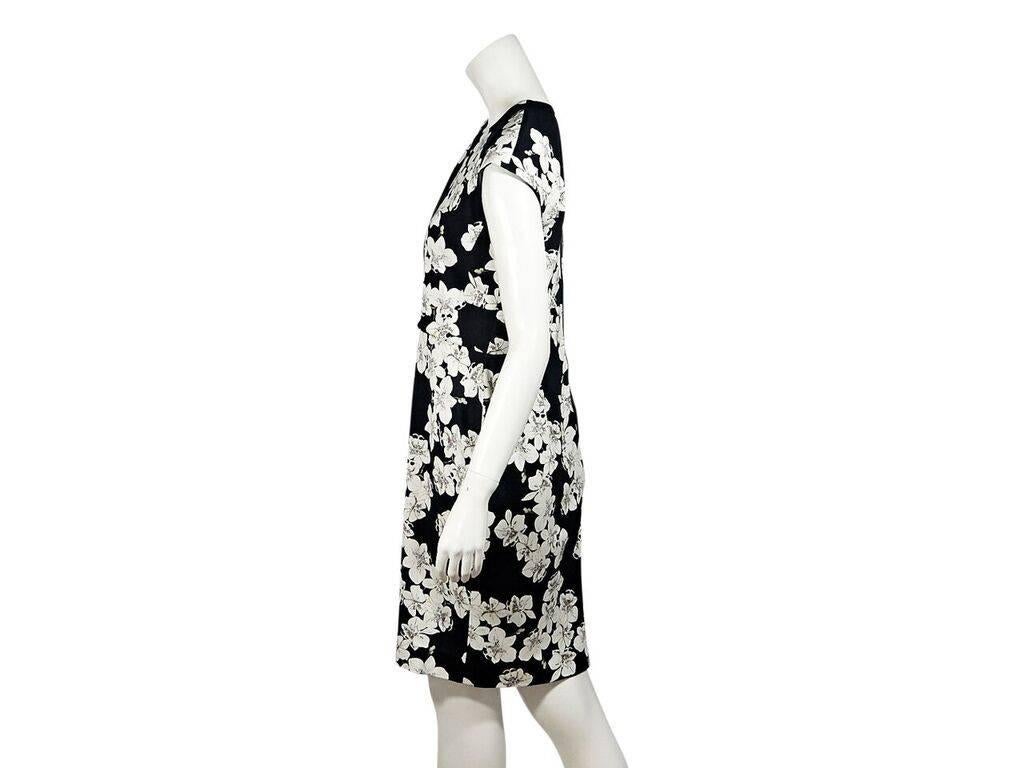 Product details:  Black and white floral-printed sheath dress by Erdem.  Roundneck.  Cap sleeves.  Banded Empire waist.  Exposed back zip closure. 
Condition: Pre-owned. Very good.
Est. Retail $ 995.00