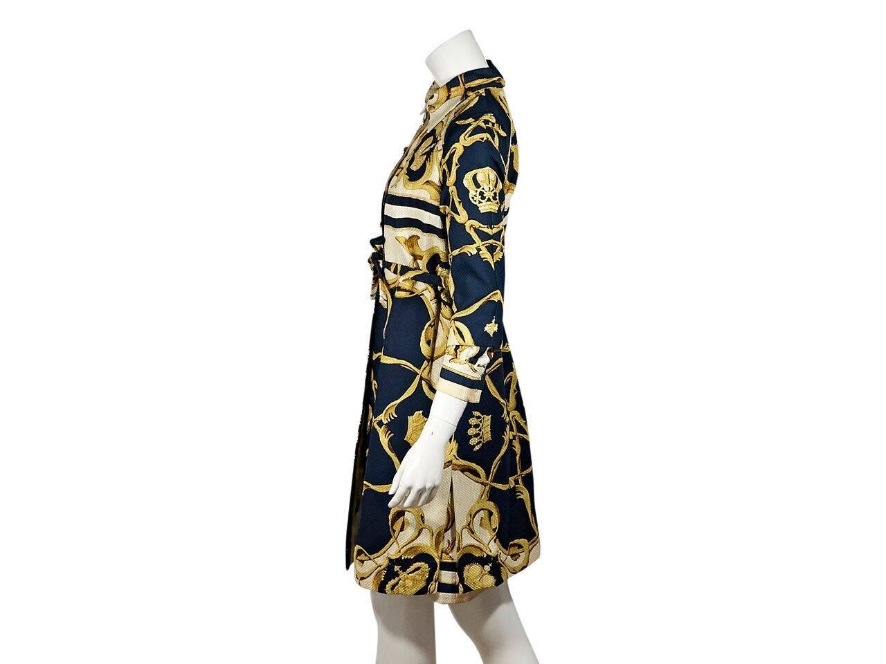 Product details:  Vintage multicolor printed coat and dress set by Hermes.  Spread collar.  Elbow-length sleeves.  Button-front closure.  Bow detail at waist.  Side hem slits.  Matching printed shirtdress.  
Condition: Pre-owned. Very good.
Est.