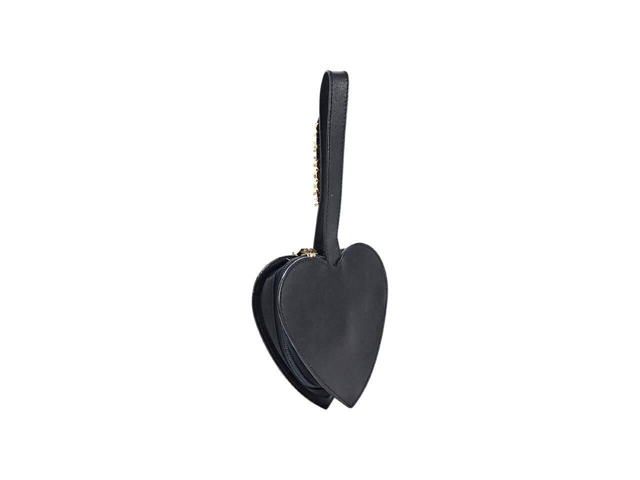 Product details:  Black leather heart wristlet by Moschino.  Accented with logo hardware.  Wristlet strap.  Zip closure.  Goldtone hardware.  6