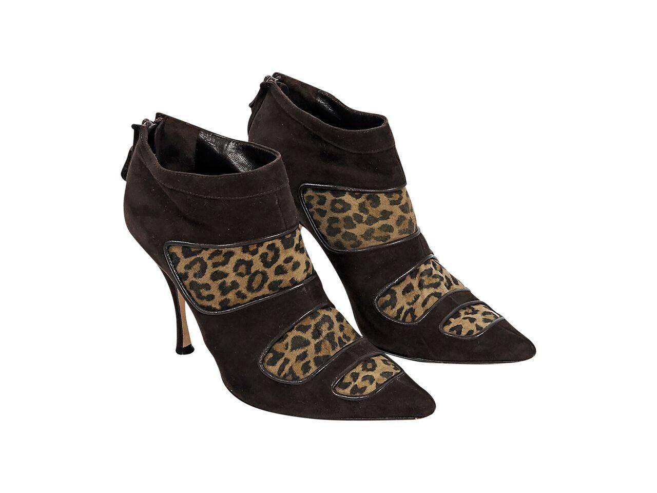 Product details:  Brown suede ankle boots by Manolo Blahnik.  Inset leopard-print panels.  Point toe.  Back zip closure. 
Condition: Pre-owned. Very good.
Est. Retail $ 798.00