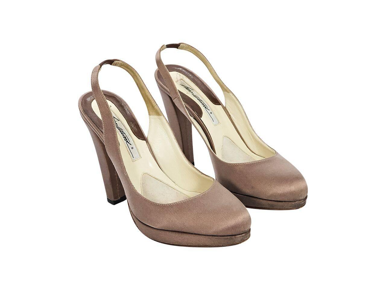 Product details:  Taupe satin slingback platform pumps by Brian Atwood.  Slingback strap with inset elastic panel.  Round toe.  Round toe.  
Condition: Pre-owned. Very good.
Est. Retail $ 548.00