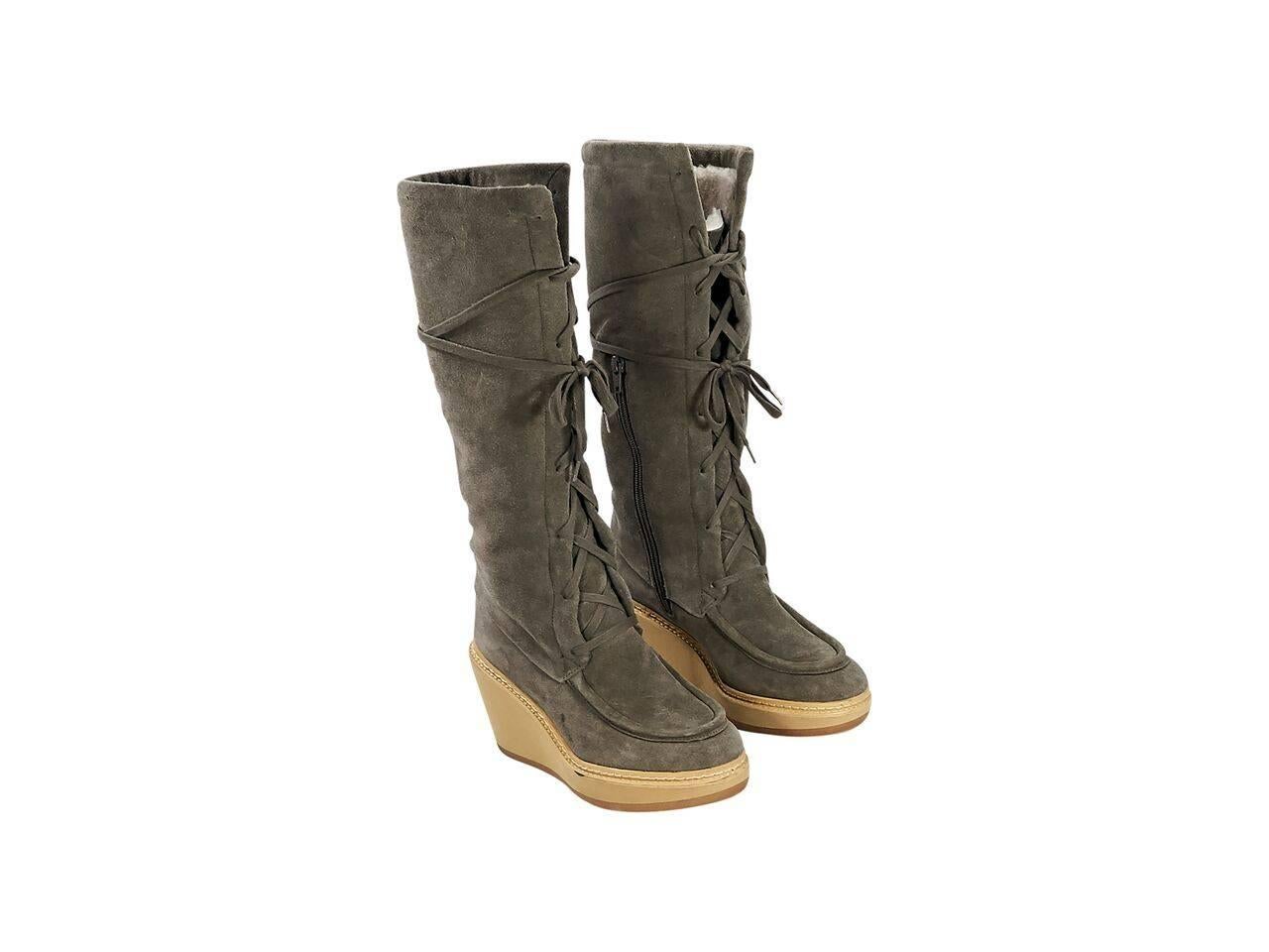 Product details:  Olive green suede tall wedge boots by See By Chloe.  Lace-up front.  Round moc toe.  Inner half zip closure. 
Condition: Pre-owned. Very good.
Est. Retail $ 700.00