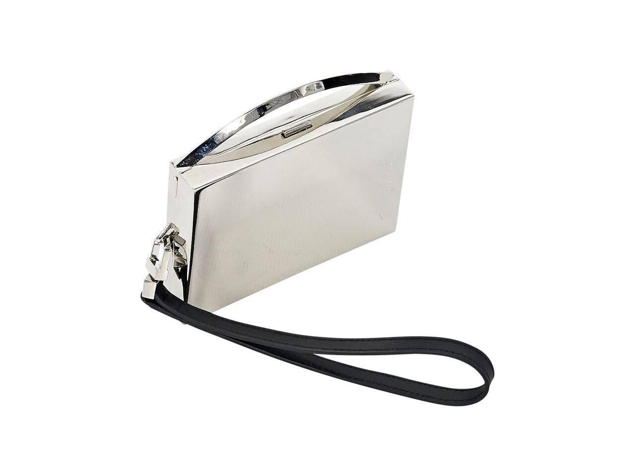 Product details:  Sterling silver card wristlet by Eddie Borgo.  Detachable wristlet strap.  Top push-lock closure.  Dual inner compartments.  Original box included.  4