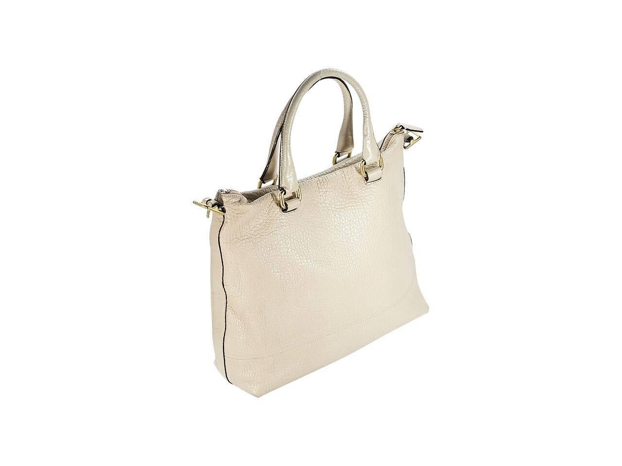 Product details:  Taupe pebbled leather tote bag by Coach.  Dual carry handles.  Top zip closure.  Lined interior with inner zip and slide pockets.  Front exterior zip pocket.  Goldtone hardware.  16.75
