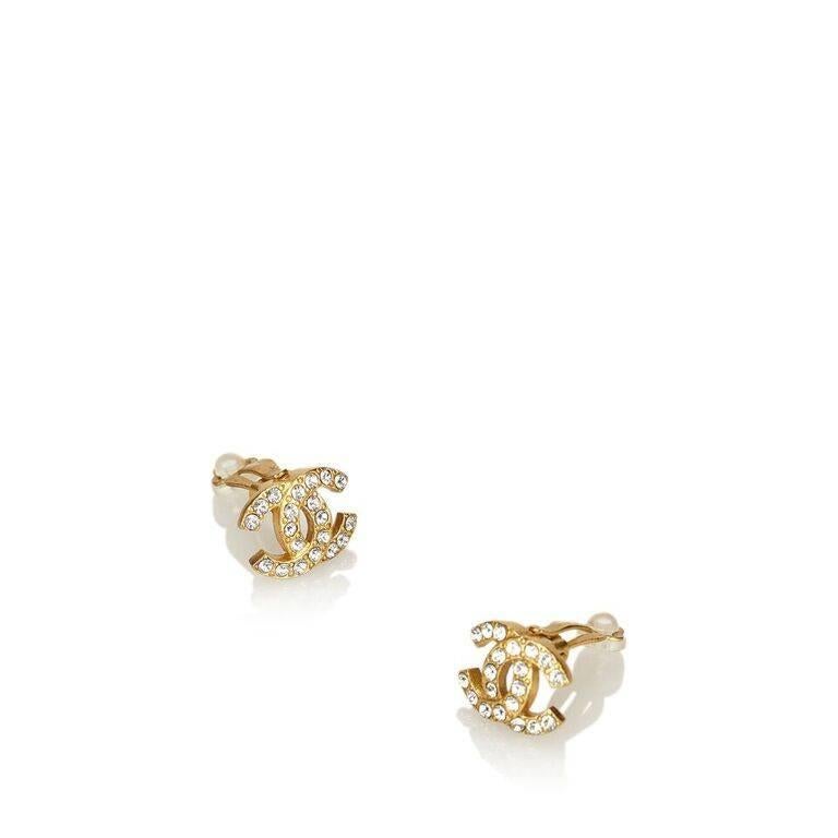 Product details:  Goldtone CC logo earrings by Chanel.  Embellished with crystals.  Clip-on backing.  1" wide.  Original box and tag included. 
Condition: Pre-owned. Very good.
Est. Retail $ 480.00