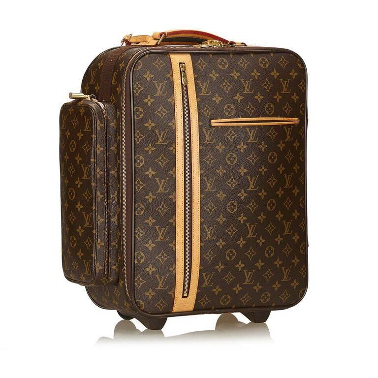 Product details:  Brown monogram canvas Bosphore 50 trolley suitcase by Louis Vuitton.  Trimmed with leather.  Top carry handle.  Zip-around closure.  Lined interior.  Front exterior slide and zip pockets.  Side exterior zip pocket.  Trolley wheels.