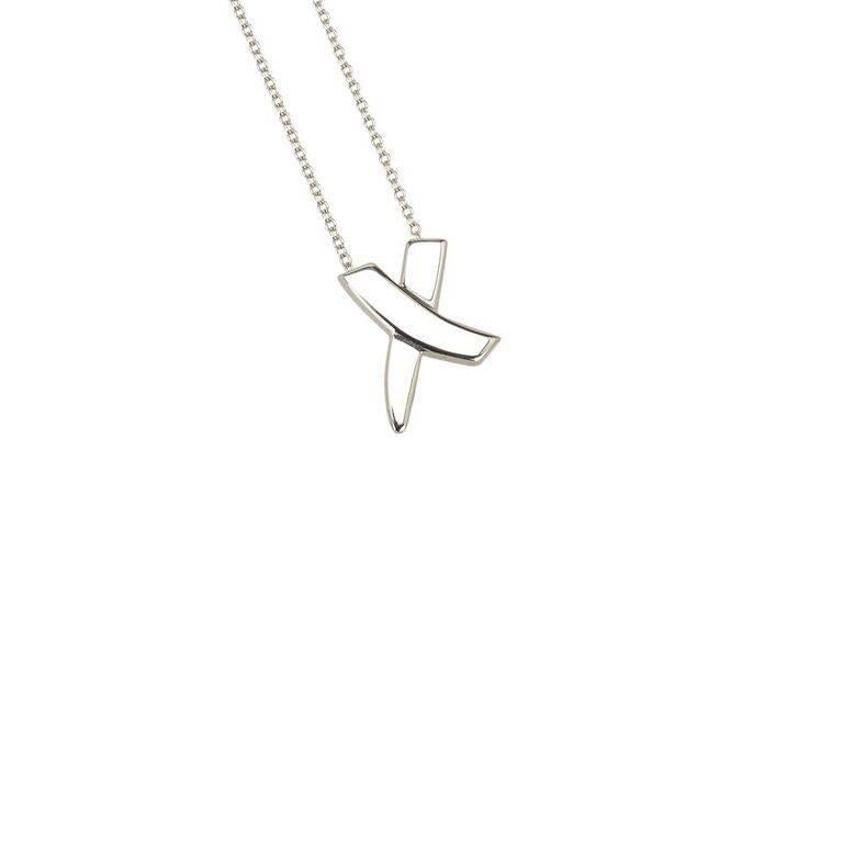 Product details:  Sterling silver X pendant necklace by Tiffany & Co.  Spring ring closure.  17