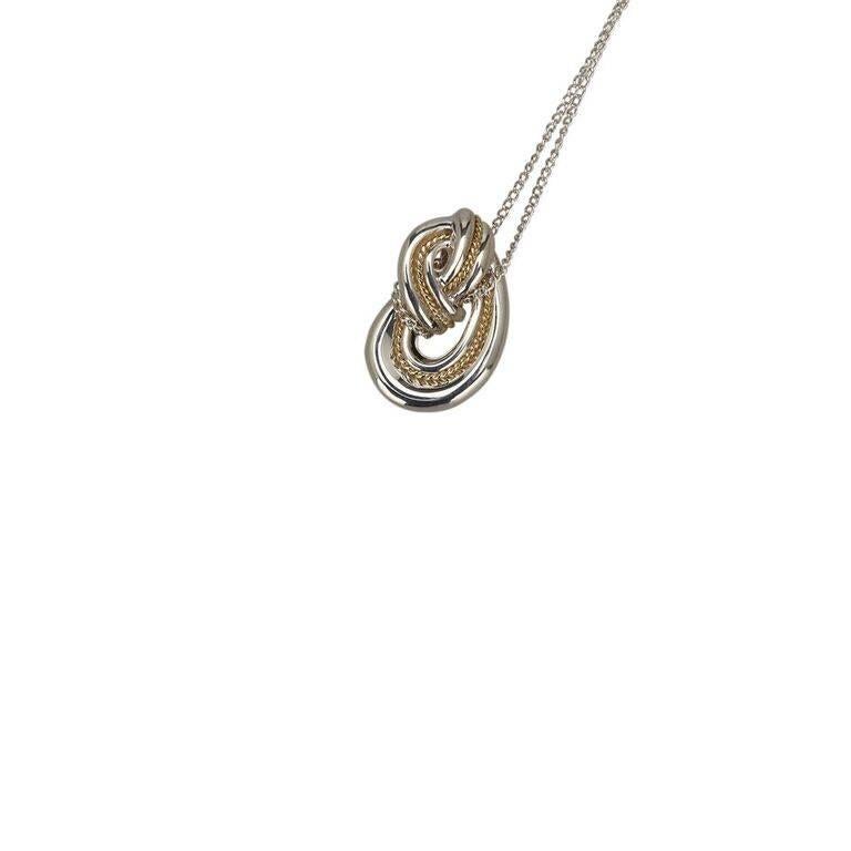 Product details:  Sterling silver knot pendant necklace by Tiffany & Co.  Spring ring closure.  18" long. 
Condition: Pre-owned. Excellent. 
Est. Retail $ 650.00