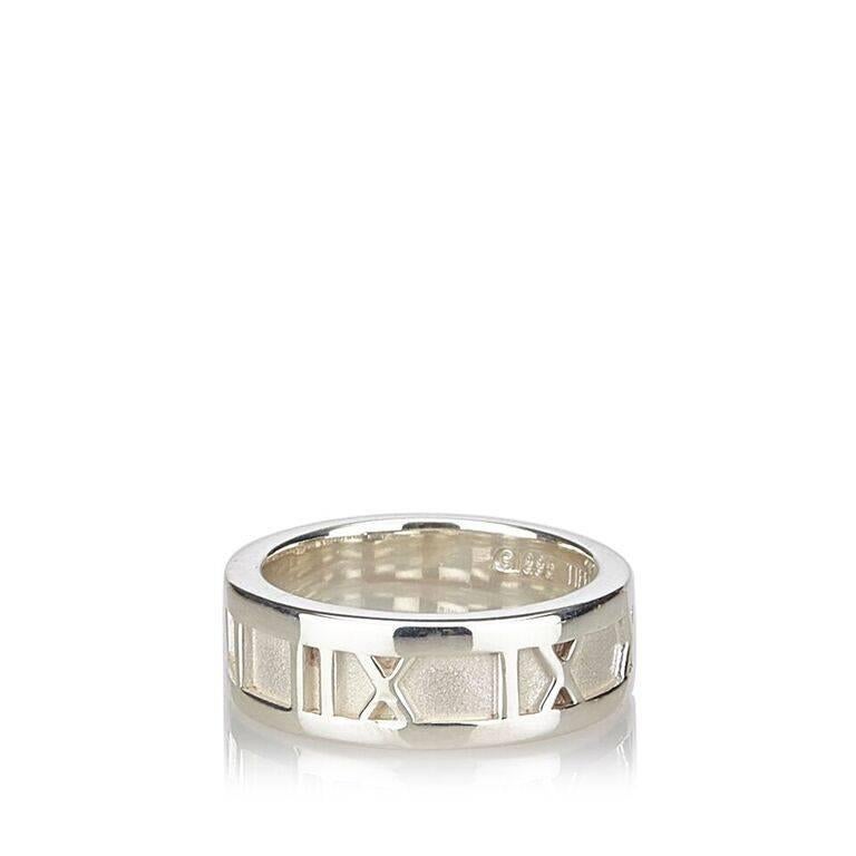 Product details:  Sterling silver Atlas ring by Tiffany & Co.  Ring size US 4/Euro 47. 
Condition: Pre-owned. Excellent. 
Est. Retail $ 200.00