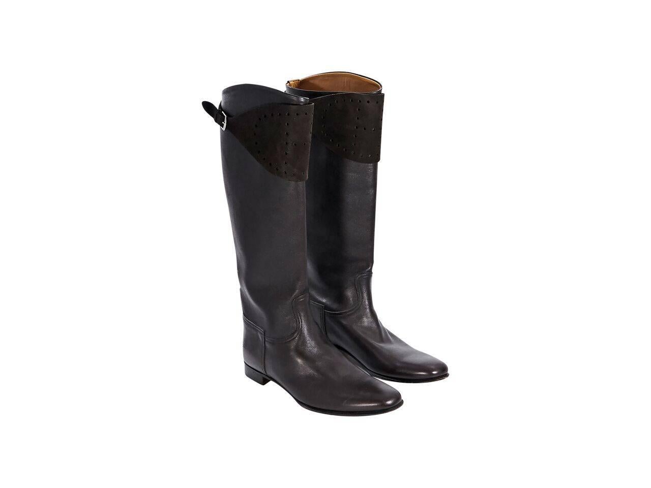 Product details:  Brown leather tall boots by Hermes.  Suede perforated shaft panel with adjustable closure.  Round toe.  
Condition: Pre-owned. Very good.
Est. Retail $ 2,385.00