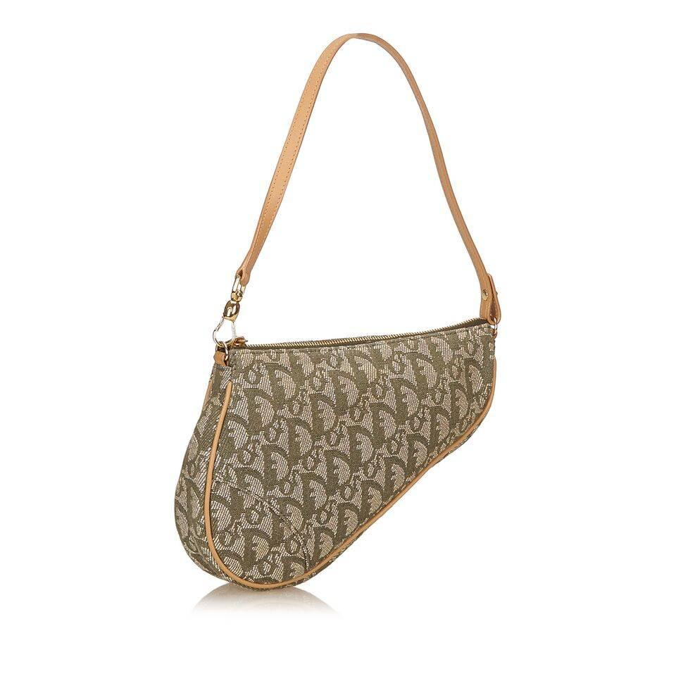 Product details:  Tan and green Diorissimo jacquard saddle bag by Christian Dior.  Detachable single shoulder strap.  Top zip closure.  Lined interior.  Goldtone hardware.  8