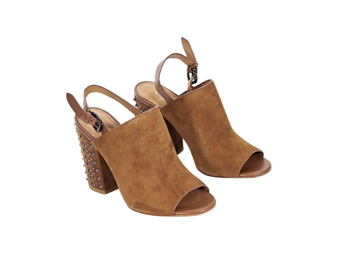 Product details:  Tan suede slingback mules by Coach.  Adjustable slingback strap.  Open toe.  Studded block heel.  Gunmetal-tone hardware.
Condition: Pre-owned. Very good.
Est. Retail $ 498.00