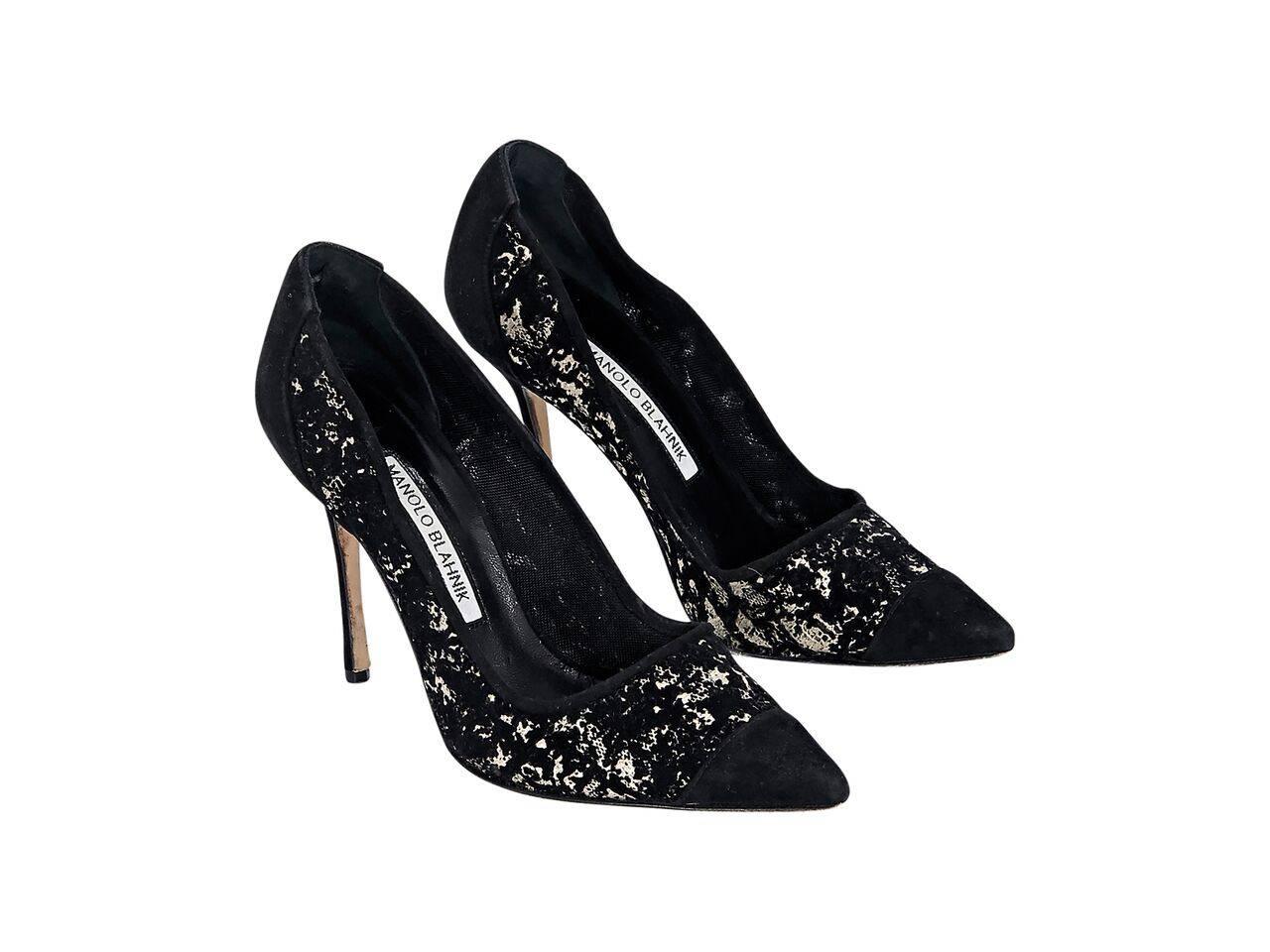 Product details:  Black and white printed suede pumps by Manolo Blahnik.  Point toe.  Slip-on style. 
Condition: Pre-owned. Very good.
Est. Retail $ 698.00