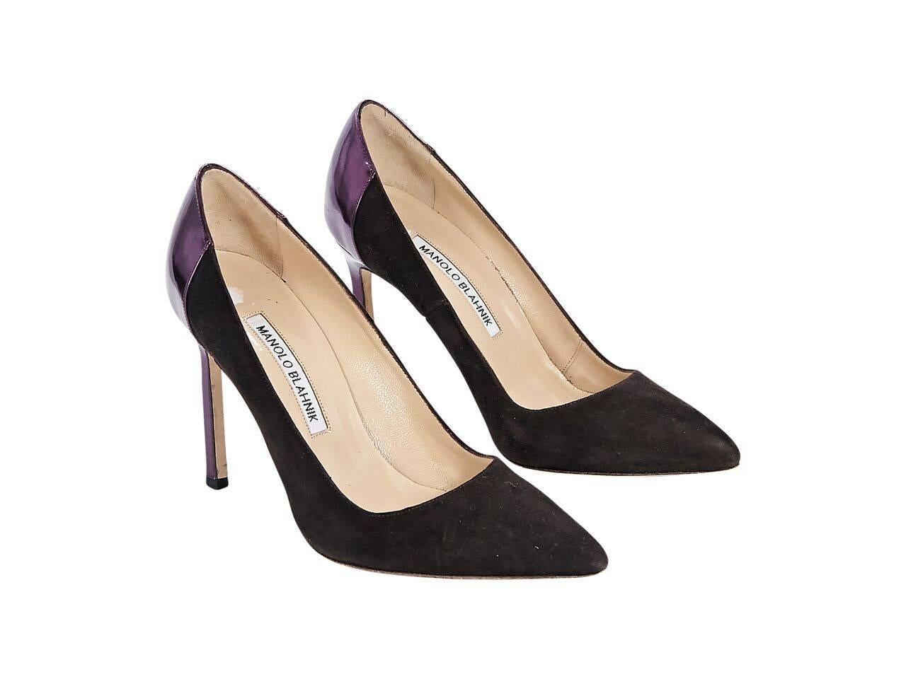 Product details:  Brown suede pumps by Manolo Blahnik.  Metallic purple leather trim.   Point toe.  Slip-on style. 
Condition: Pre-owned. Very good.
Est. Retail $ 798.00