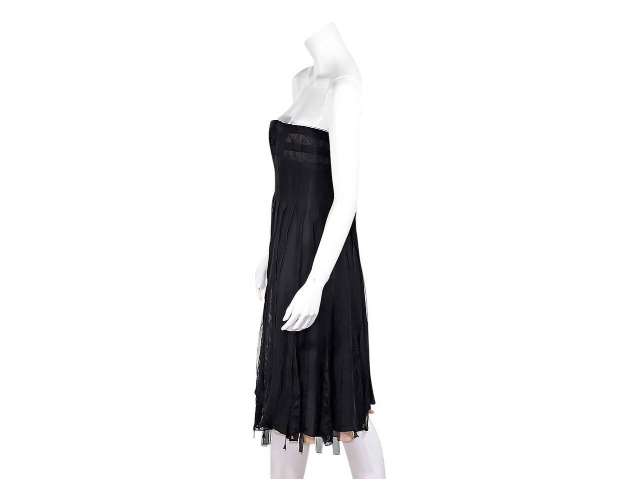 Product details:  Black strapless silk dress by Carmen Marc Valvo.  Inner boning support.  Inset lace panels.  
Condition: Pre-owned. Very good.
Est. Retail $ 2,500.00