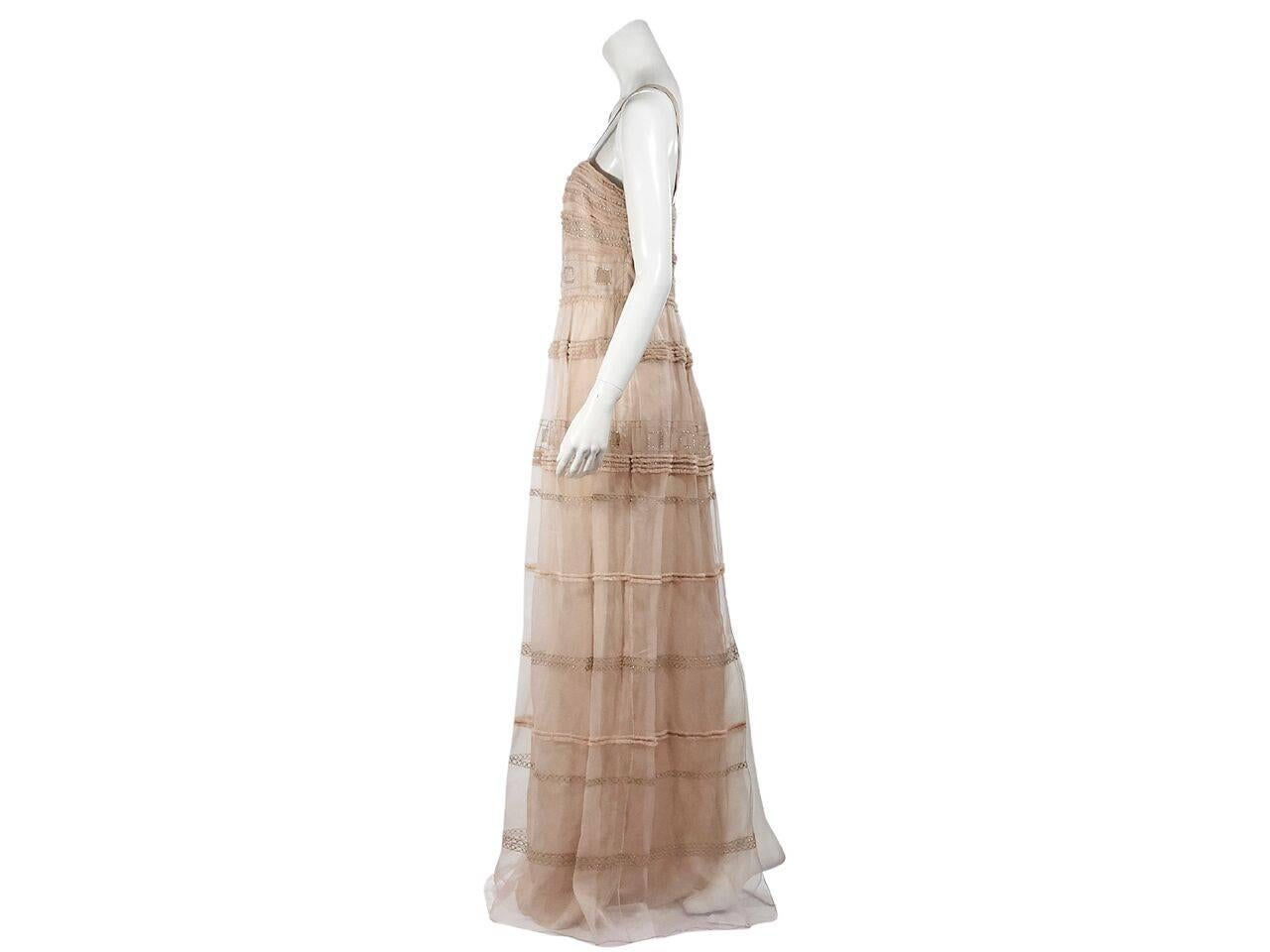 Product details:  Nude Cambon silk maxi dress by Temperley London.  Embelished with crystals.  Squareneck.  Sleeveless.  Concealed back zip closure.  Back center hem slit. 
Condition: Pre-owned. New with tags.
Est. Retail $ 3,930.00